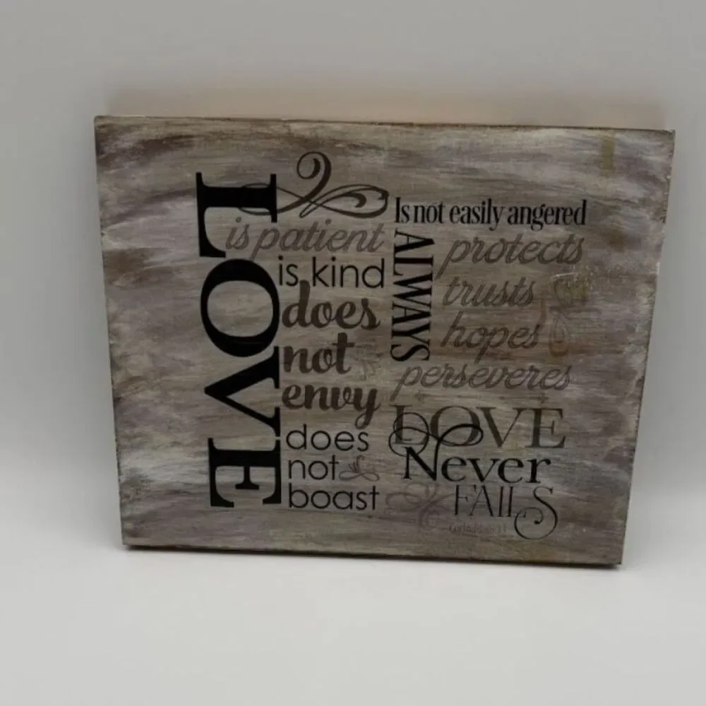 Decorative wall sign with the text from 1 Corinthians 13:4-8